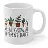 WE ALL GROW AT DIFFERENT RATES MUG
